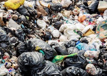 Garbage in dumped pits are dirty and smelly in the countryside.